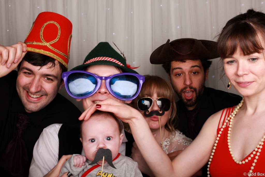 Cute baby with mustache in photo booth