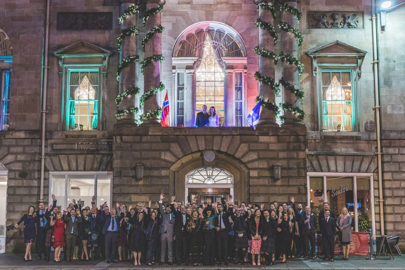 Philippa & Kristian outside The Trades Hall of Glasgow with their wedding guests