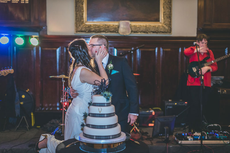 Bride & Groom cut the cake at Trades Hall of Glasgow Wedding
