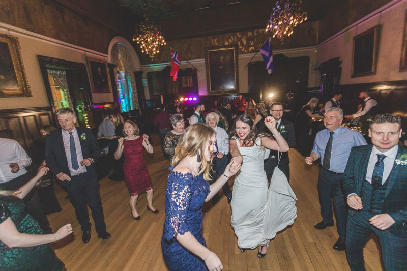 Guests dance with bride at Trades Hall of Glasgow Wedding