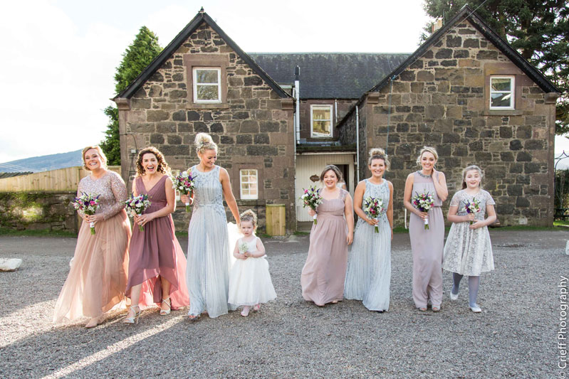 Bridesmaids dresses walk in courtyard Comrie Croft