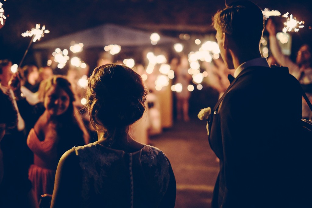 bride and groom wedding guests with sparklers