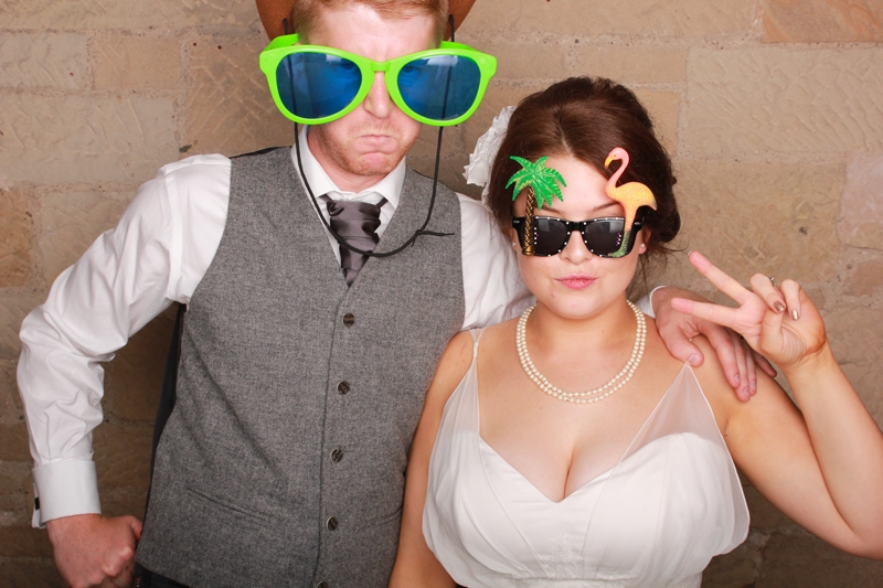 Bride and Groom using stone wall backdrop in wedding photo booth Glenbervie House Hotel Stirling