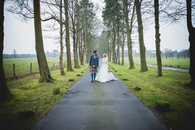 Blair and Shona walking through grounds of Glenbervie House Hotel