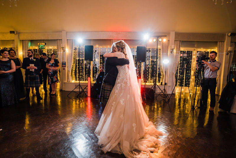 Bride and Father of the bride embrace during first dance Carlowrie Castle