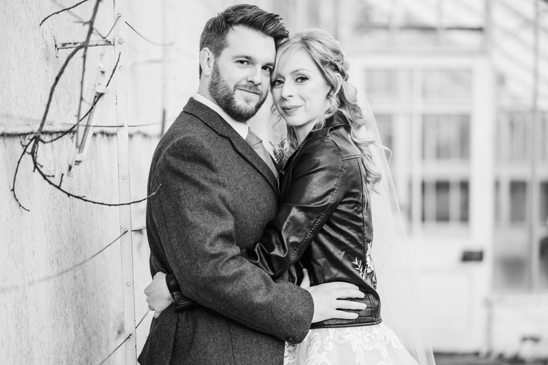 Bride and Groom posing for photo Carlowrie Castle Gardens