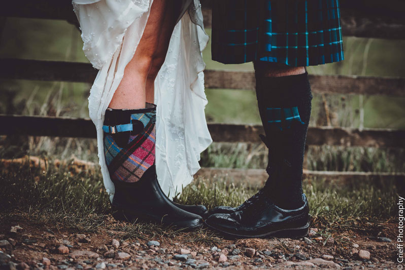 Bride in wedding boots outdoor wedding