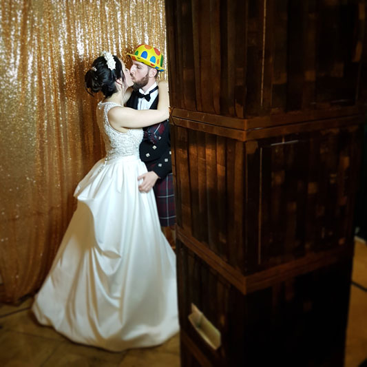 Bride and Groom first kiss in Auchen Castle Wedding Photo Booth