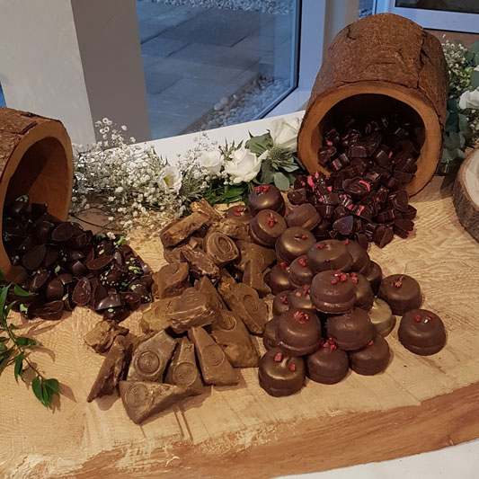 Log with spilled chocolates wedding GG's Yard