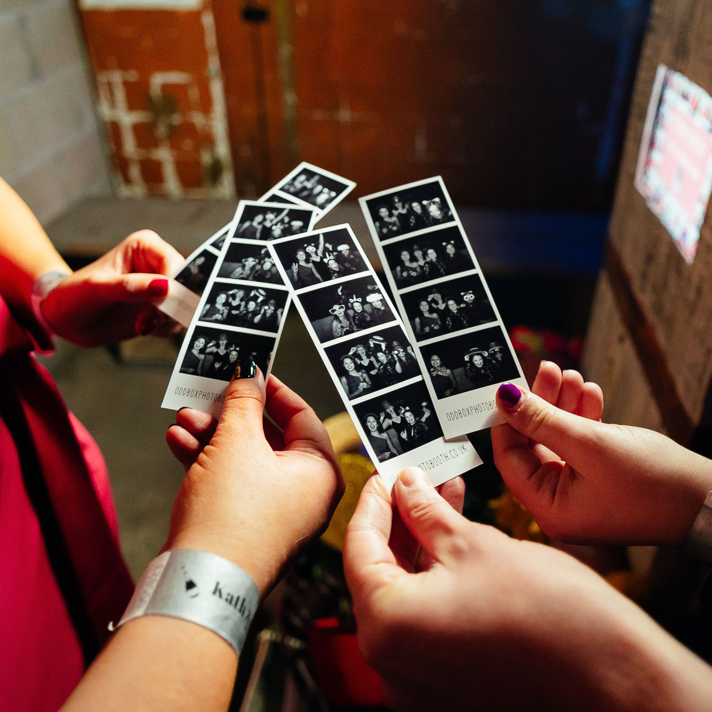 Guests Holding Odd Box Photo Booth Prints Biscuit Factory